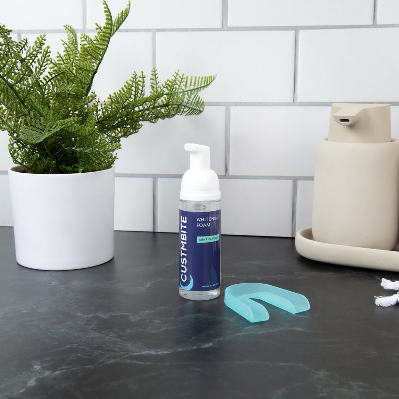 An easy to use pump applicator and tray with a mild 8% teeth whitening foam solution.